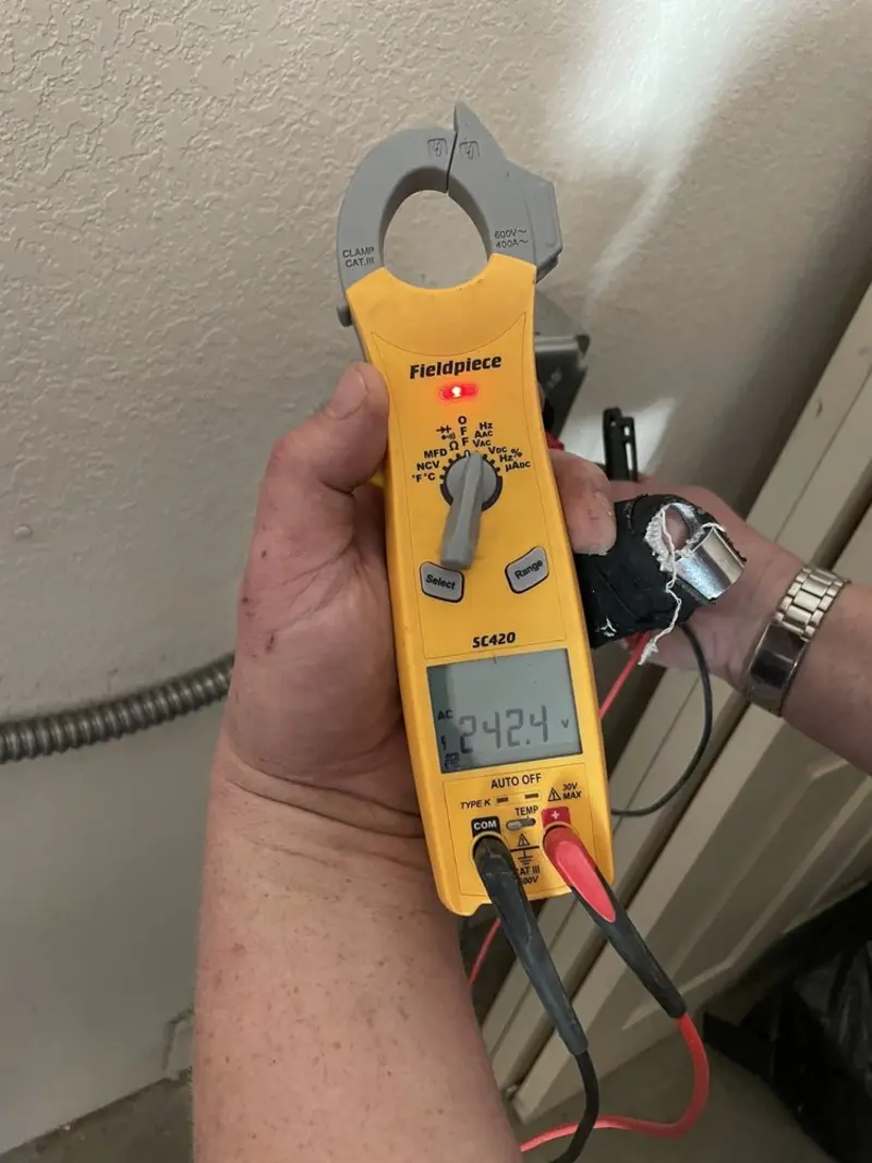 Voltage testing with clamp meter during Electrical Installation Services in Sevierville